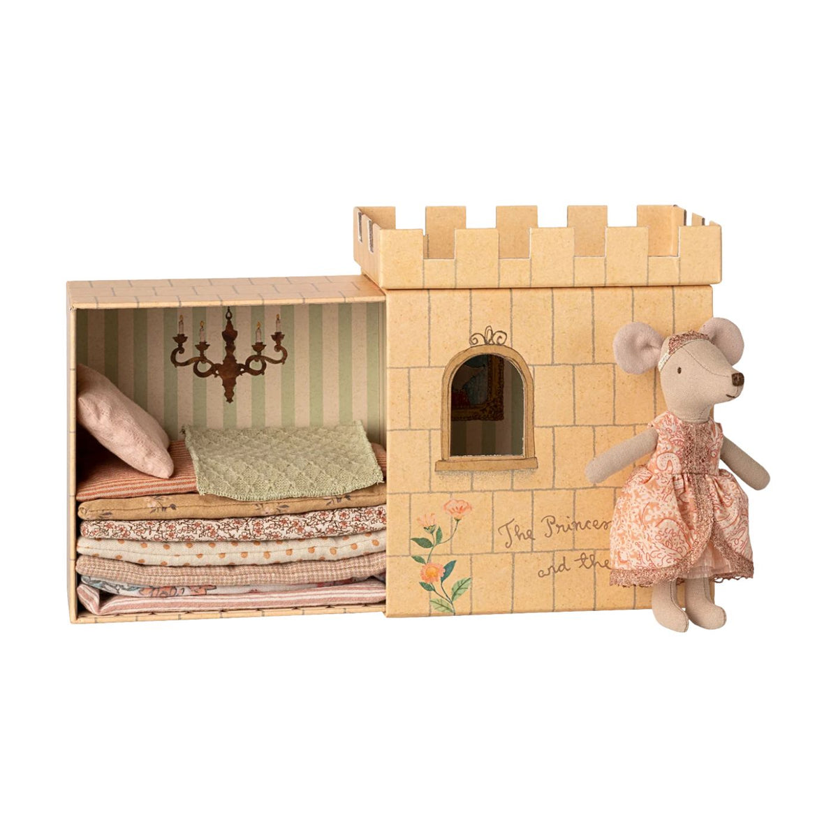 A Maileg toy set featuring a Big Sister mouse wearing a pink dress and tiara, standing beside an illustrated castle box that opens to reveal a stack of colorful mattresses and a pillow on a wooden bed frame.