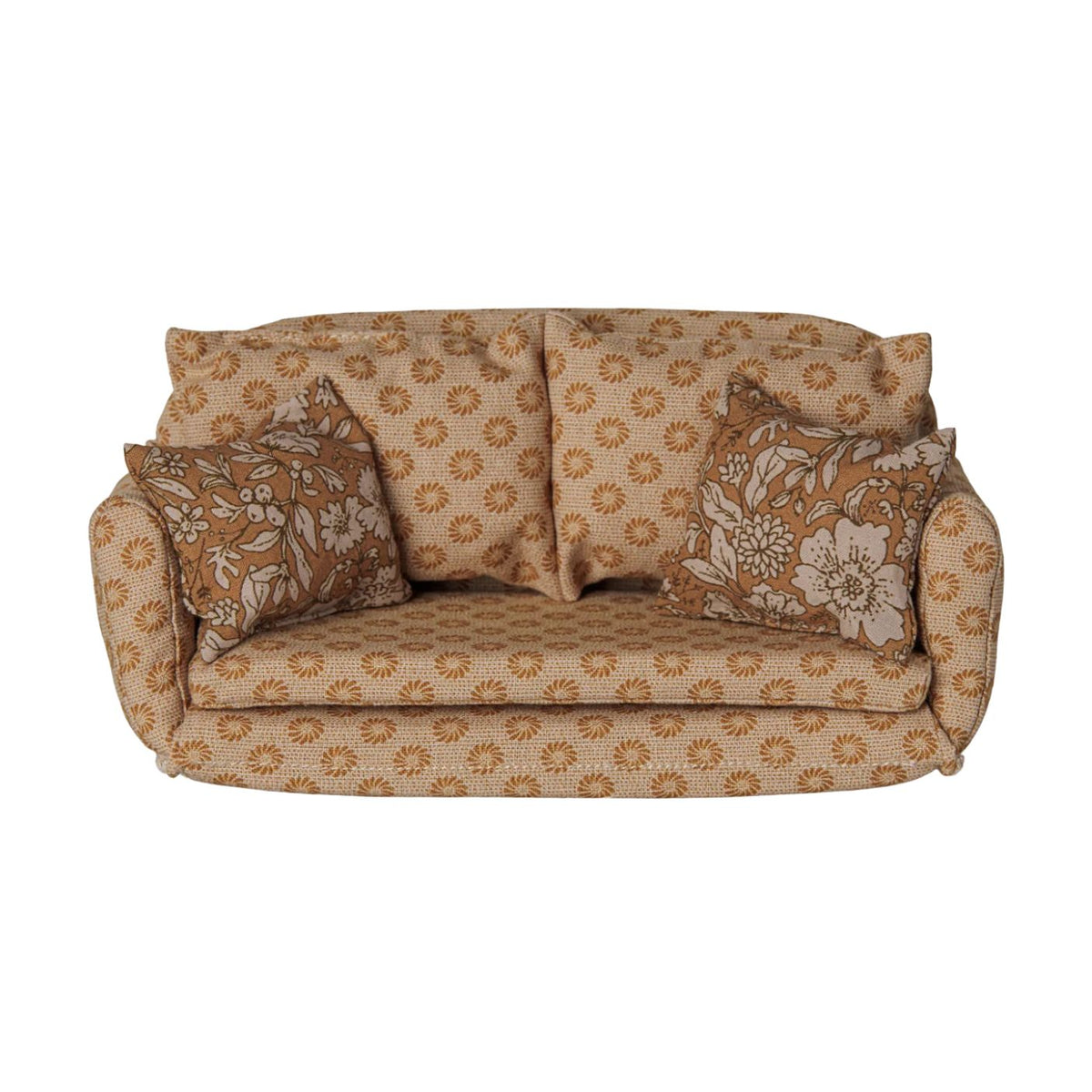 A miniature ocher fabric sofa bed for a toy mouse house, featuring a retro floral pattern in shades of brown and cream, complete with matching back cushions and side pillows on a white background.