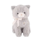 A soft grey plush kitten toy sitting upright, featuring a cream-colored muzzle with delicate embroidered facial details and a white satin ribbon bow tied around its neck.