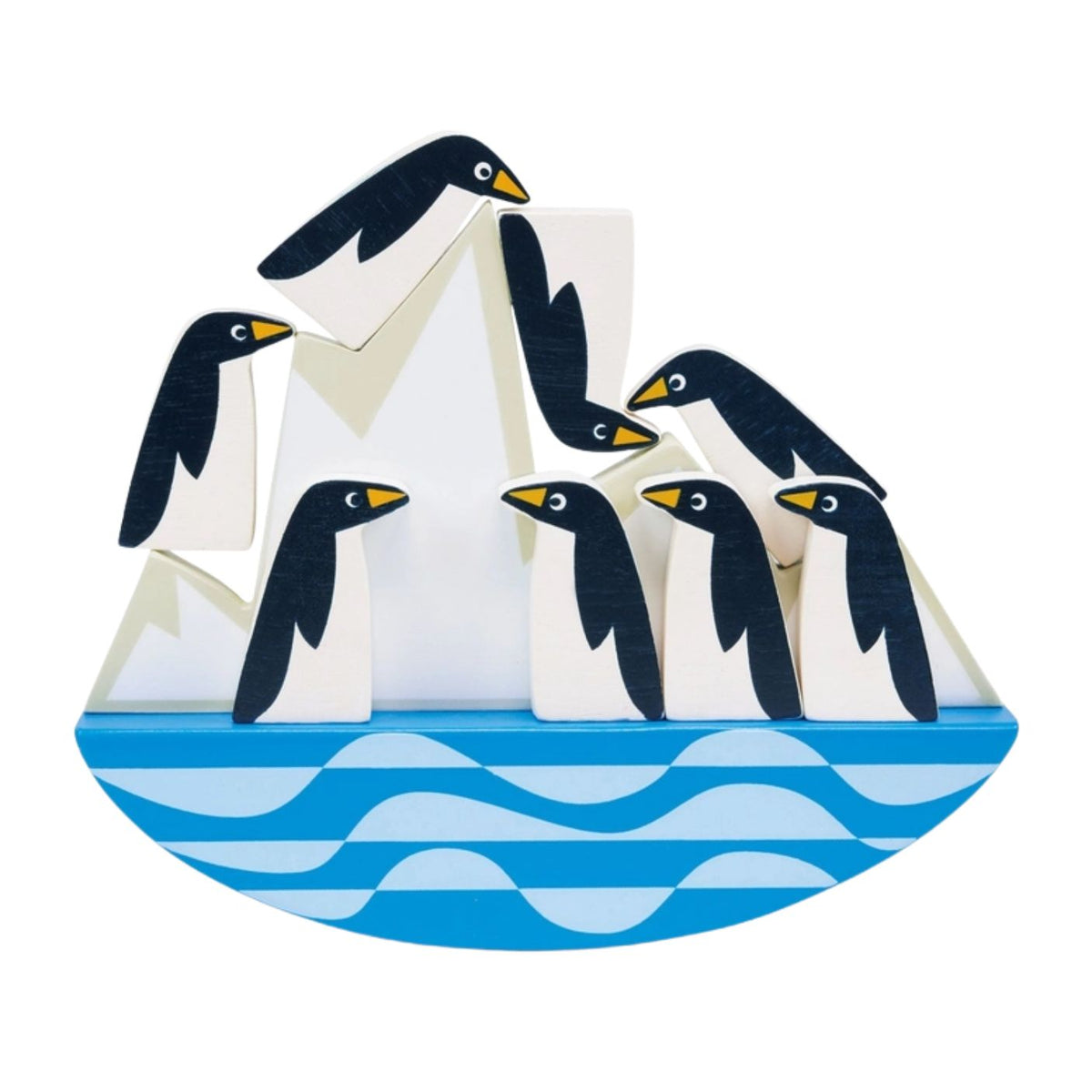 A collection of eight smooth, stylized wooden penguins balancing and stacked on top of a rocking white iceberg base resting on a blue-and-white wavy ocean design against a clean white background.