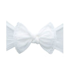 A white fabric bow with delicate lace trim on a plain white background.