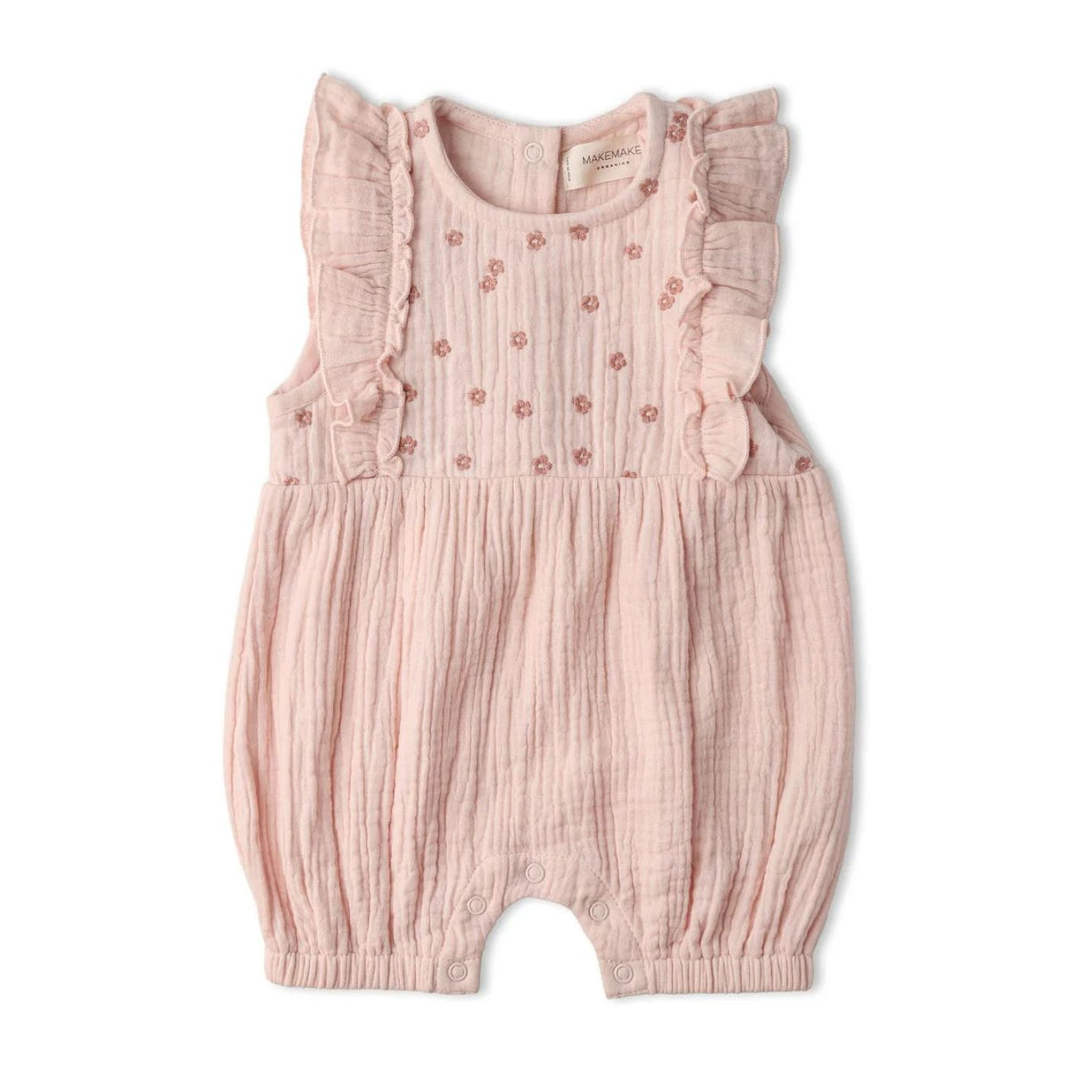 A baby girl's sleeveless romper in light pink muslin gauze, featuring ruffled shoulder straps, embroidered pink floral details on the chest, and an elastic leg opening.