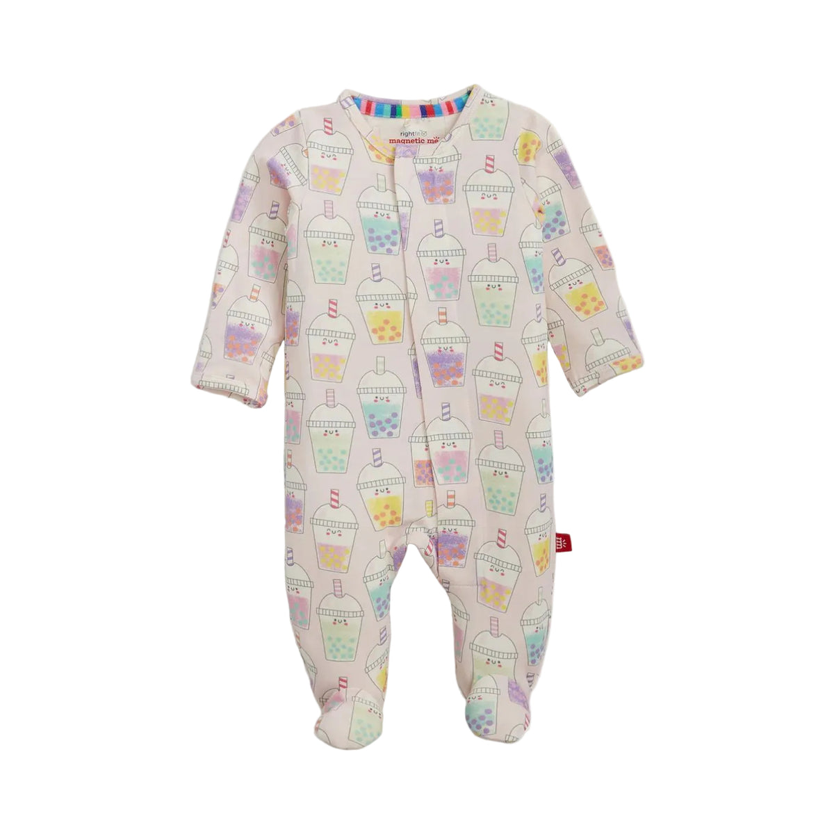 A baby footed sleeper in a warm cream color, featuring an all-over pastel bubble tea cup pattern in pink, blue, yellow, and green. The sleeper has long sleeves, a front zipper closure, and a small red tag on the lower right leg.