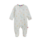 A baby footed sleeper in white ribbed cotton muslin fabric, featuring a colorful pastel print of rainbows, suns, clouds, and dots, with a rainbow-striped collar.