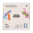Coco Studio Jumbo Rainbow Sidewalk Chalk box by cocovillage, showing a white package with colorful illustrations of rainbow chalk sticks and product icons, including a bucket and a blue textured stick.