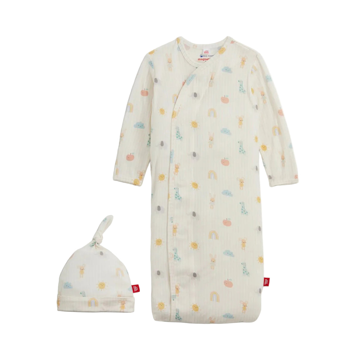 A baby sleep sack and matching beanie hat set in a warm off-white ribbed cotton muslin fabric, decorated with a whimsical pastel print of rainbows, suns, giraffes, and pumpkins. The set is displayed on a clean white background.