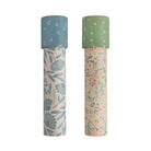 Two Mushie paper kaleidoscopes standing vertically against a white background, featuring the Floral Combo pattern with green caps and botanical floral illustrations.
