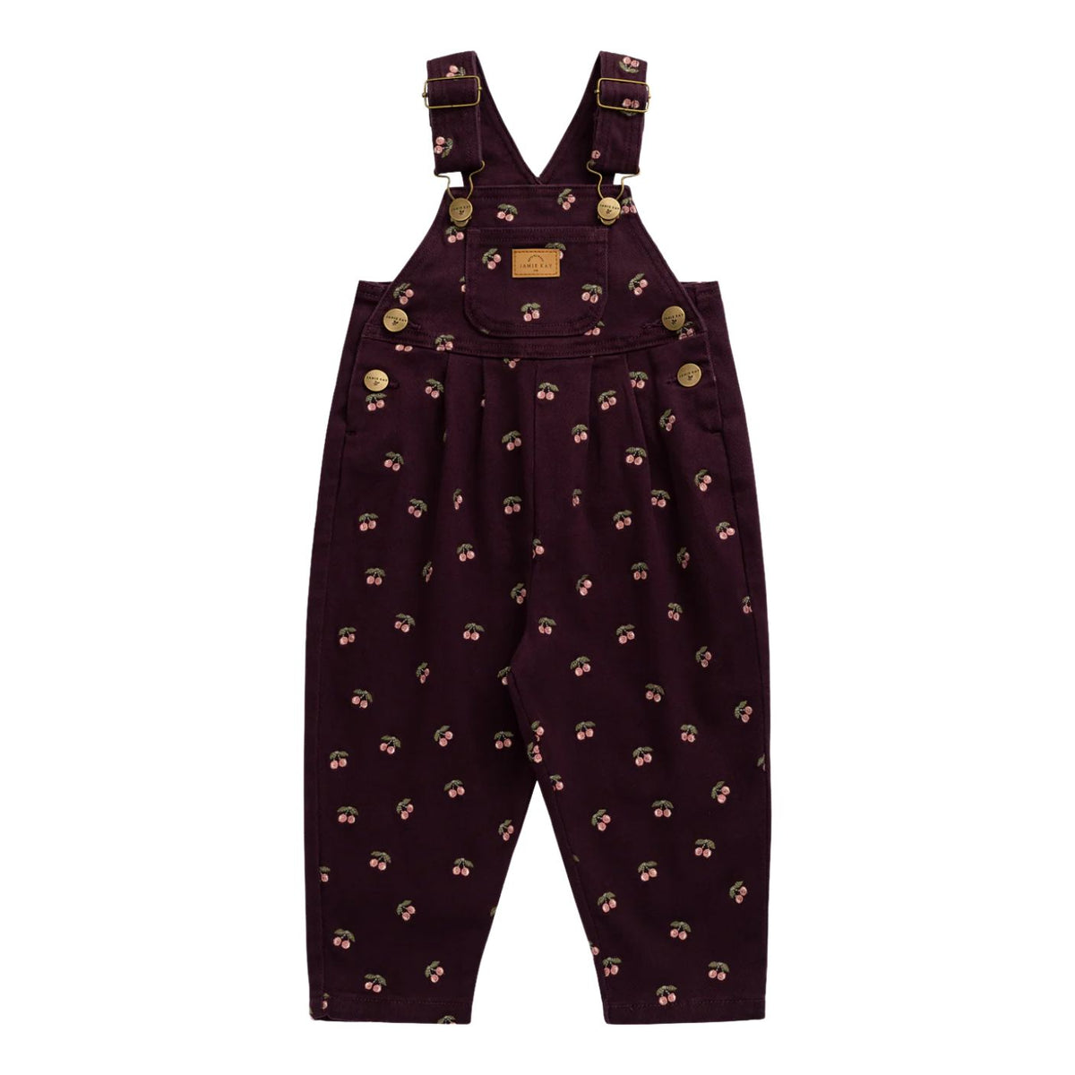 A pair of toddler boy's dark purple corduroy overalls with a small repeating pattern of cartoon faces, gold buttons, and adjustable shoulder straps, shown flat on a white background.