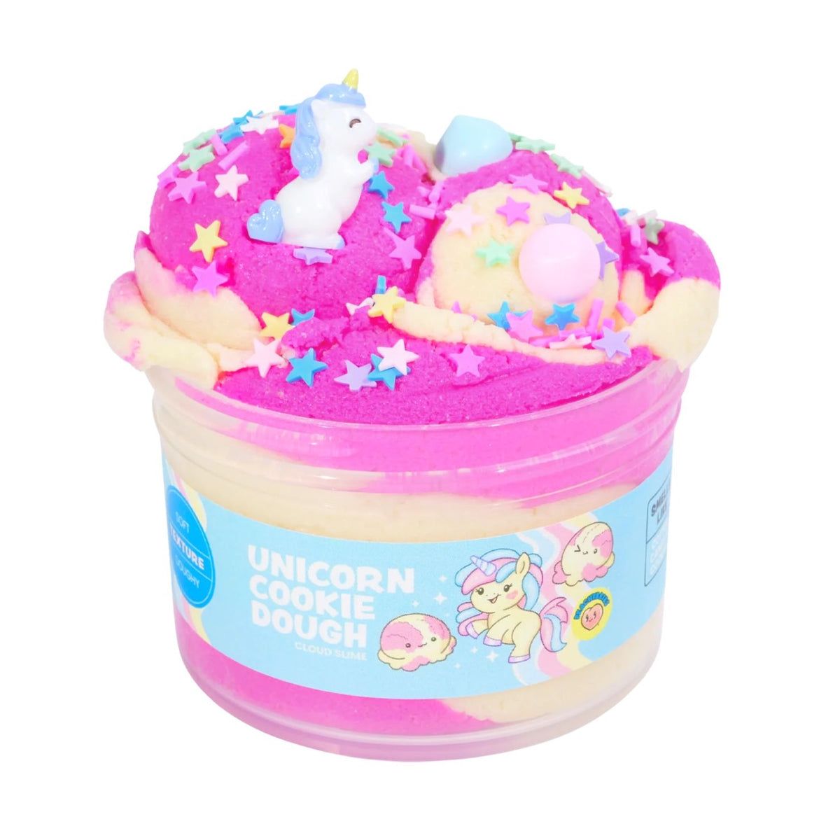 Jar of unicorn-themed cookie dough with colorful decorations on a white background