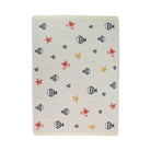 A rectangular baby blanket with a nautical pattern of striped fish, starfish, and crabs on a cream background, shown flat against a white background.