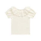 An off-white short-sleeve baby top with a large ruffled collar and puff sleeves, shown flat on a white background.