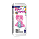 Packaged set of Magna-Tiles travel micro-mags tiles in a clear plastic clamshell container with a white label. The label features a pink heart-shaped structure built from the translucent tiles and text including 'microMAGS travel HEART TO HEART.