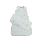 Light blue baby sleeping bag with yellow duck patterns on a white background