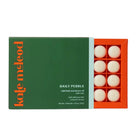 Kole Meleod Daily Pebble solid bath and shower oil packaging with green and orange design.