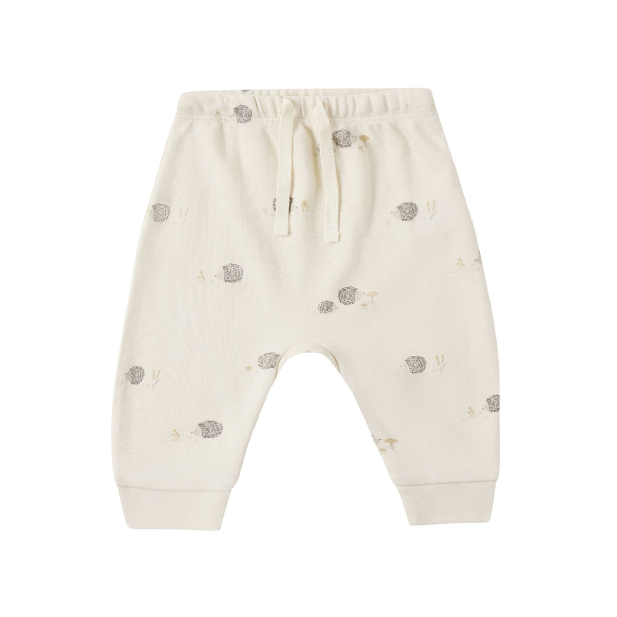 Off-white cotton baby pants with a small gray hedgehog pattern, featuring an elastic waistband with a drawstring and ribbed ankle cuffs.