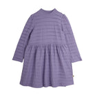 A lavender purple textured dress with long sleeves, a mock neck, and a tiered waist, shown from the back against a light gray background.