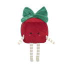A cute plush toy shaped like a red strawberry with a green velvet bow on its head, a smiling embroidered face, and striped cream-and-white arms and legs, shown on a plain white background.