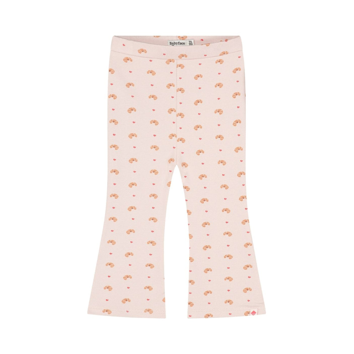 A pair of light pink flared leggings with an all-over repeating pattern of small orange-brown teddy bears and tiny red hearts, shown flat against a white background.