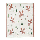 A square textile product, likely a blanket or quilt, featuring a pattern of brown moose and green pine trees on an off-white background, finished with a brown border.