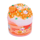 A novelty squishy toy shaped like a pumpkin cow in a clear plastic tub, featuring orange glittery slime, a small orange pumpkin, and a cow face on top, with a label reading 'PUMPKIN COW'.