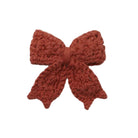 A rich, earthy redwood crochet hair bow with a textured, delicate design, attached to a gold alligator clip and centered against a plain white background.