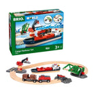 Brio World Cargo Harbour Set toy train set shown with its retail box and assembled wooden tracks, cargo ship, crane, bridge, and small vehicles on a white background.