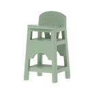 Green high chair on a white background