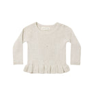 A cream-colored ribbed knit sweater with long sleeves and a ruffled hem, shown flat against a white background.