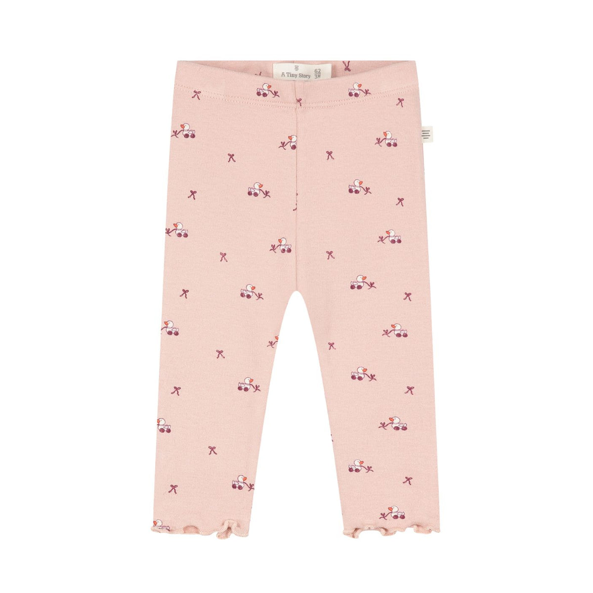 Pink toddler leggings with a small repeating pattern of tiny red cars and bows, featuring a ruffled hem.