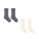 Two pairs of ribbed crew socks on a plain white background: one pair is dark gray and the other pair is off-white/cream.