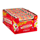 A box of Giant Smarties Candy Rolls, Original flavor, containing 25 individual candy rolls. The packaging is bright red with colorful illustrations of candy pieces and the yellow 'giant' logo.