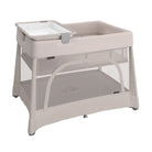 A beige UPPAbaby Remi V2 Playard shown with an attached changing station and bassinet insert on a white background.