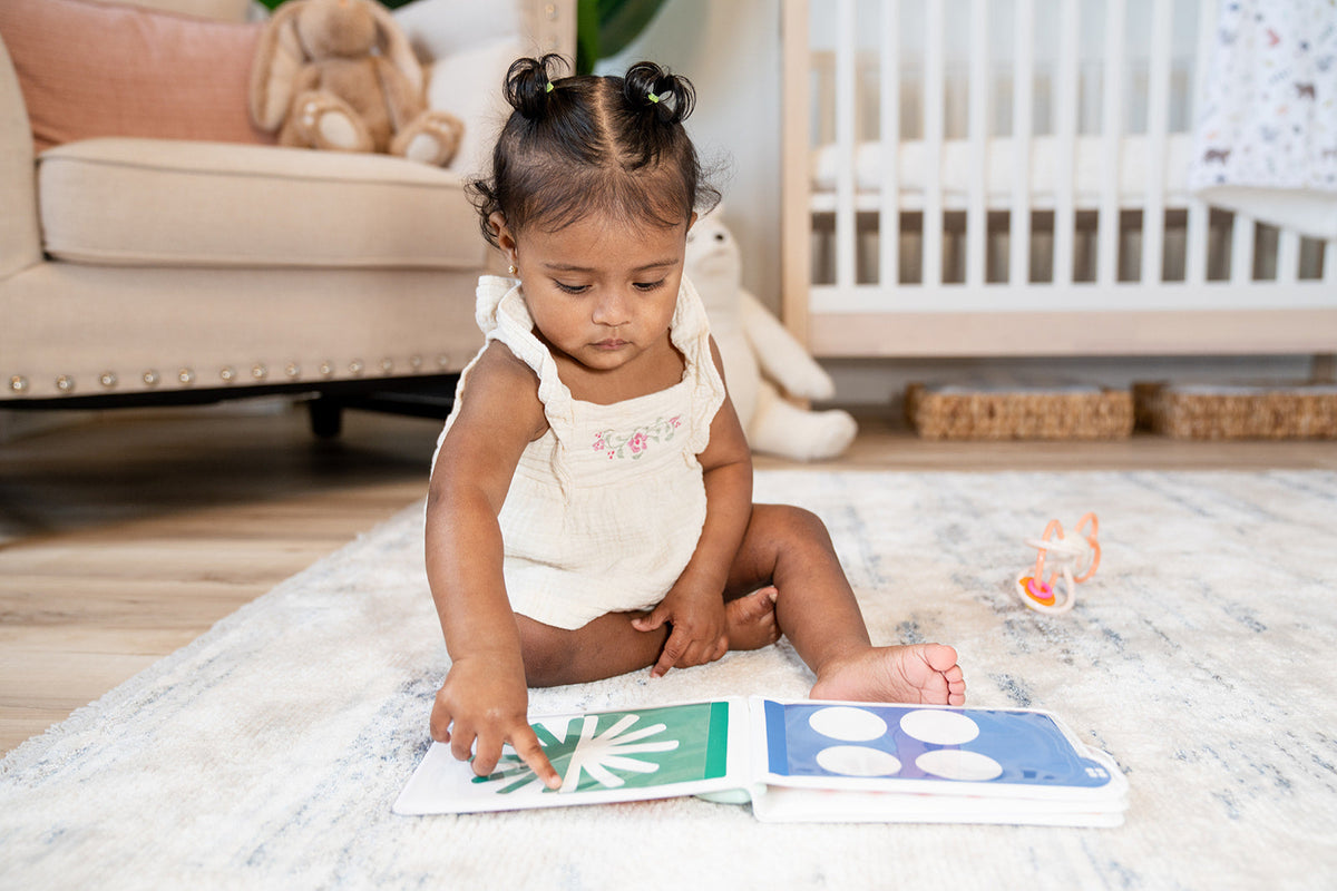 Child playing with educational toys on a rug in a home setting