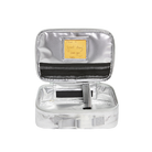 Silver toiletry bag with a black item inside on a white background