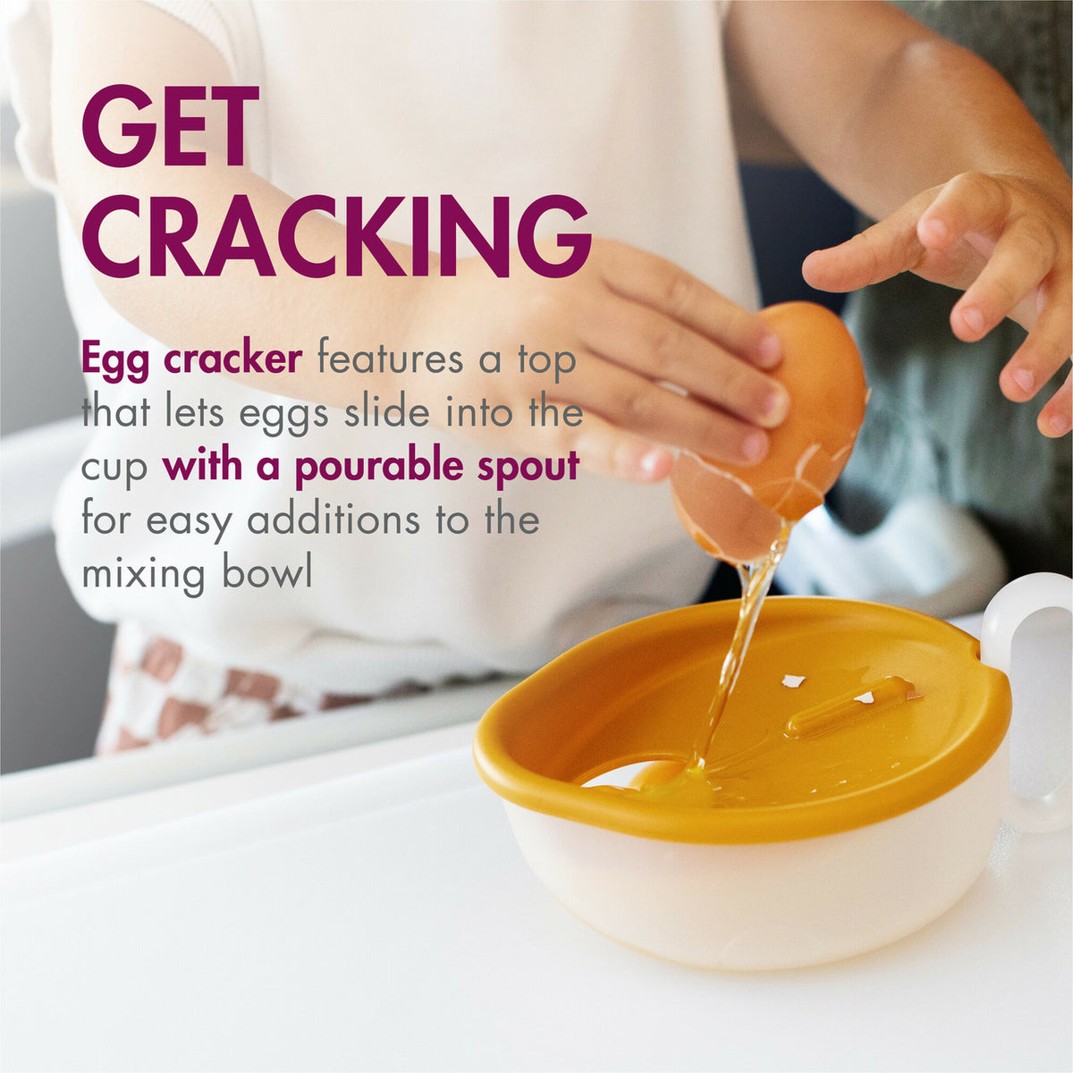 Egg cracker being used to pour liquid into a bowl with text describing its features.