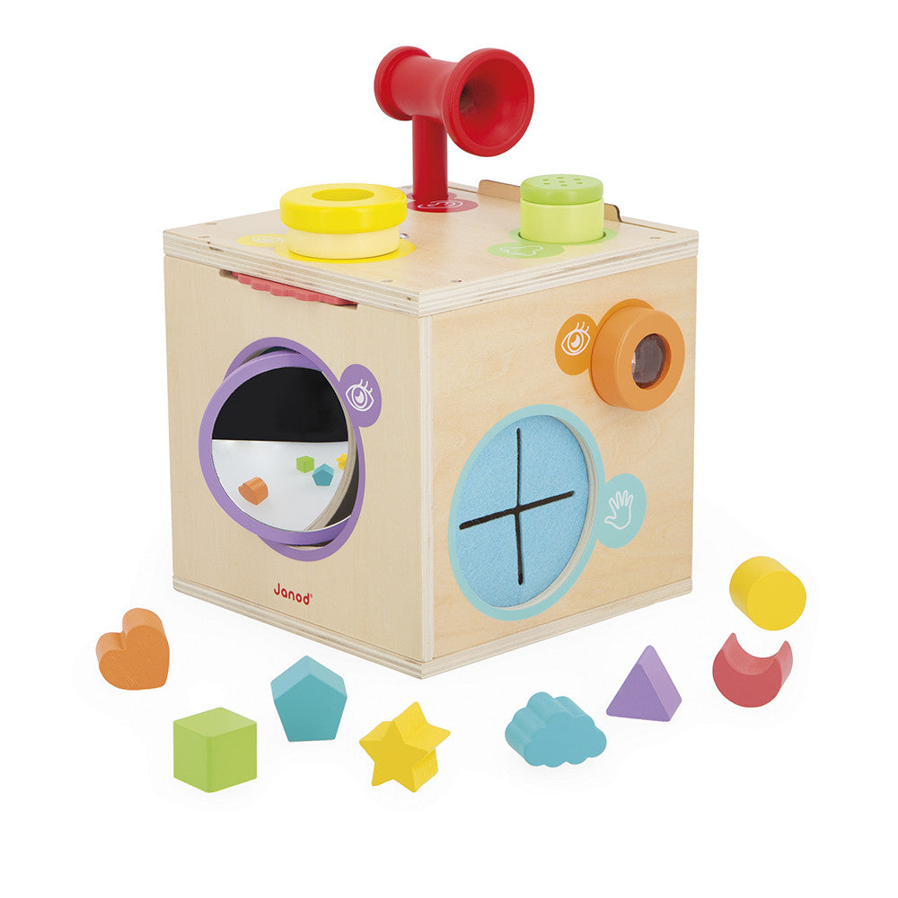 Wooden shape sorting cube with colorful shapes on a white background