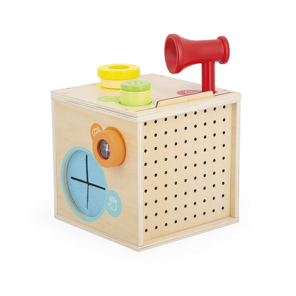 Wooden toy box with colorful components on a white background