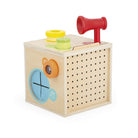 Wooden toy box with colorful components on a white background