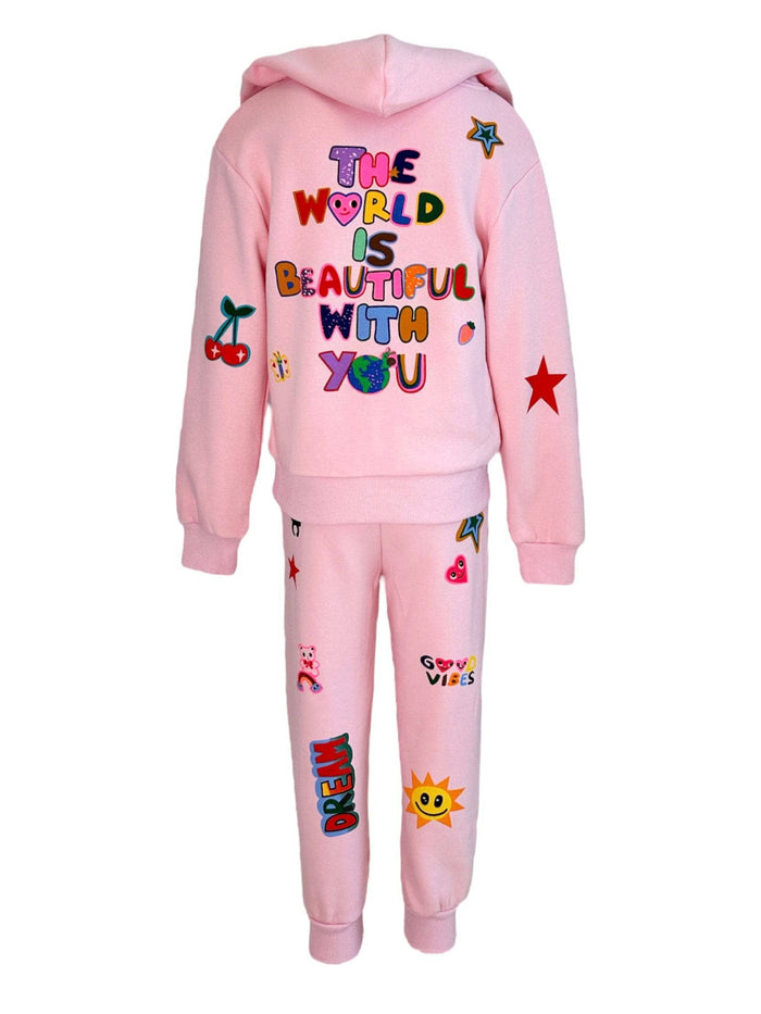 Pink children's hoodie and pants set with colorful text and graphics on a white background