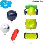 SmartMax My First Car 6-piece set contents layout displaying a dark blue roof piece, a white smiling face ball figure, a red magnetic bar, a green car chassis with wheels, a lime green middle car block, and a curved yellow-green base piece.