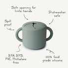 Green sippy cup with features listed on a white background