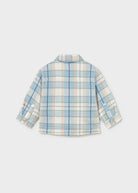 A children's long-sleeve plaid shirt shown from the back, featuring a light blue, cream, and white checkered pattern with thin orange stripes, photographed on a light gray background.