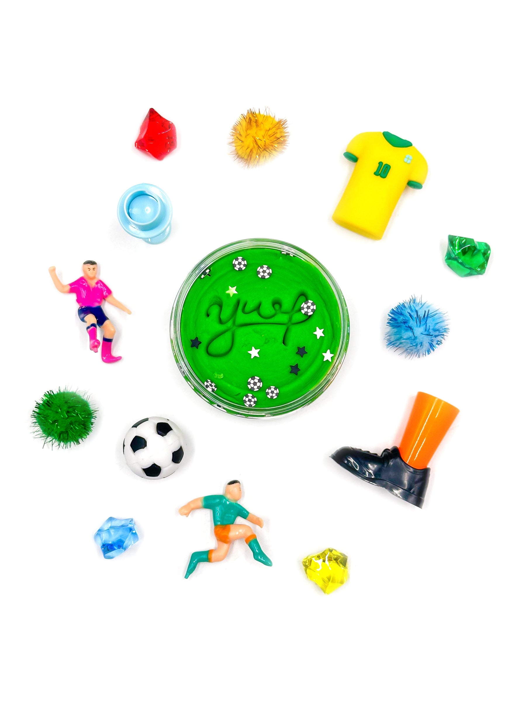 Collection of colorful soccer-themed toys and accessories on a white background