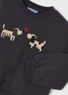 A close-up of a dark charcoal gray crewneck sweatshirt featuring two embroidered dachshund dogs and a small red heart on the chest.