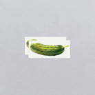 Two pickles on a white background with a gray border