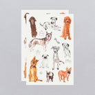 Two sheets of dog-themed temporary tattoos on a gray background