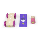 Wooden toy car parts on a white background