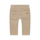Back view of a pair of beige corduroy pants for toddlers, featuring two back pockets and a small brown brand patch on the right pocket, shown against a plain white background.