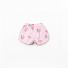 Pink shorts with tulip pattern on a white background