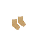 Pair of beige socks on a white background
